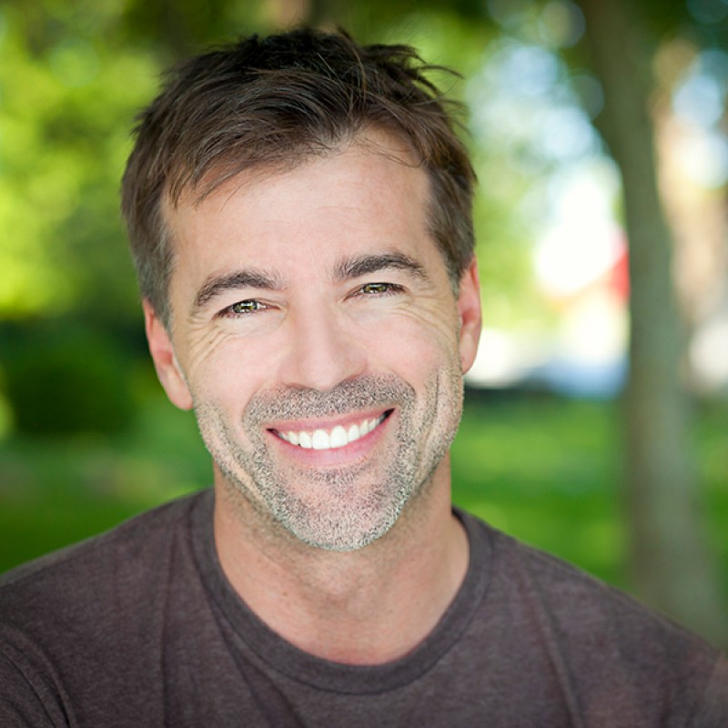 Picture of a smiling adult man with straightened teeth