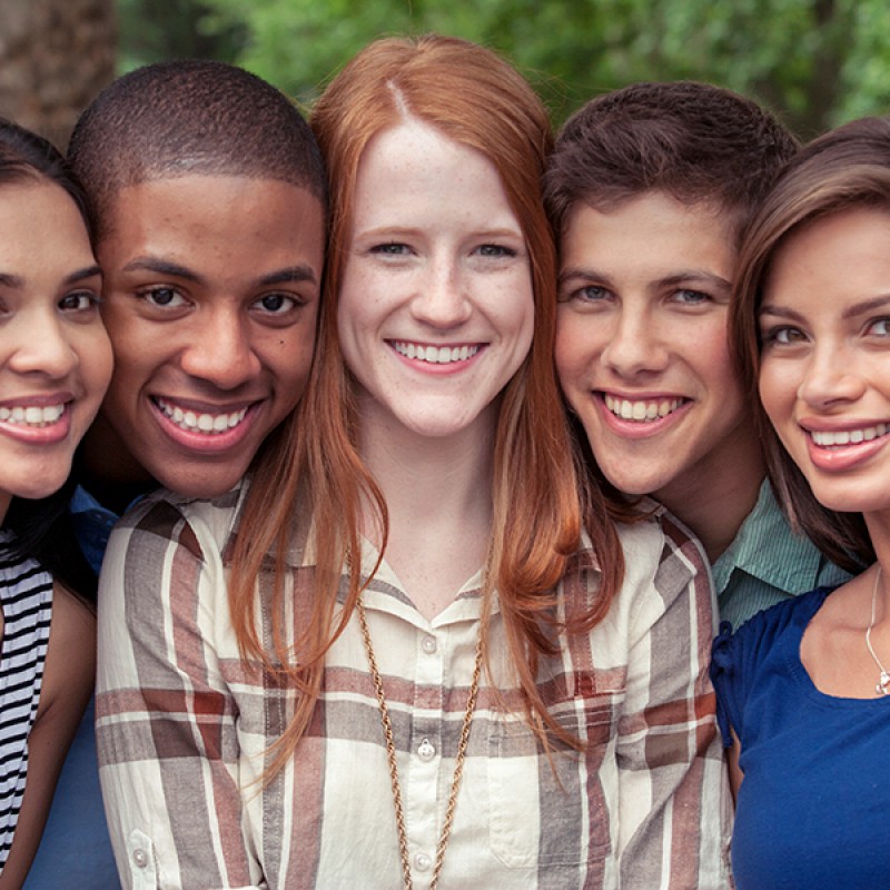 Picture of five young people with great teeth smiling